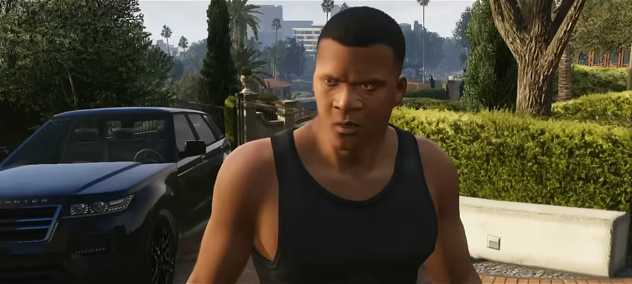 Franklin Clinton in a black tank top beside a parked SUV on a leafy hillside street
