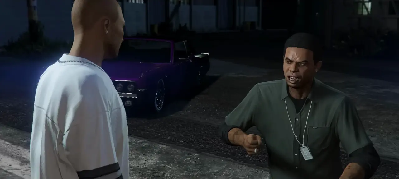 Lamar Davis in a green shirt and dog-tag chain arguing on a street at night beside a lowrider
