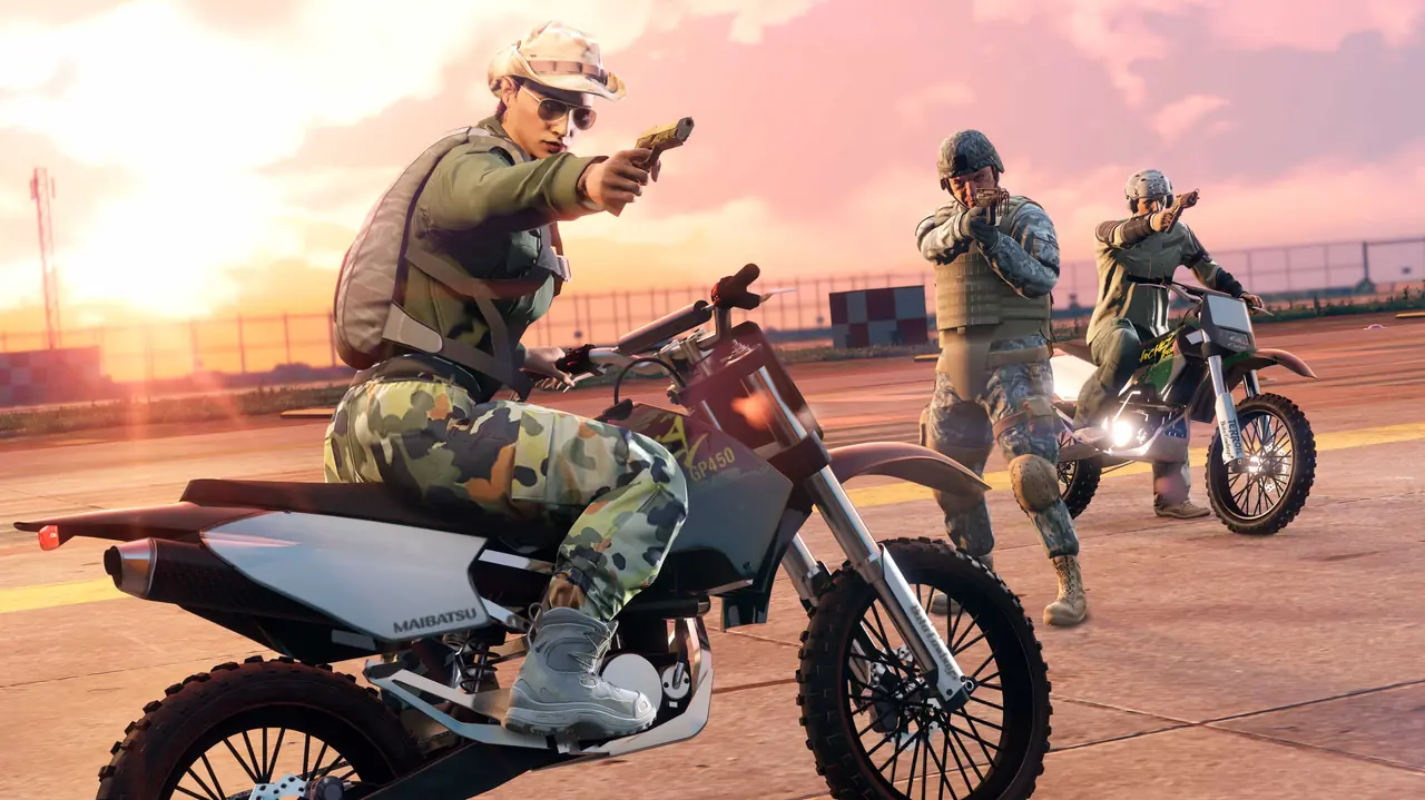 Soldiers on Maibatsu Sanchez dirt bikes on an airfield at sunset