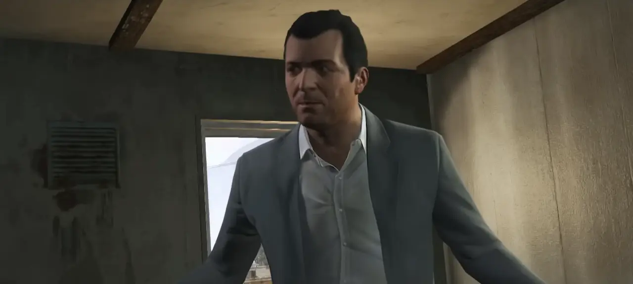 Michael De Santa in a grey suit stepping through the doorway of a run-down room
