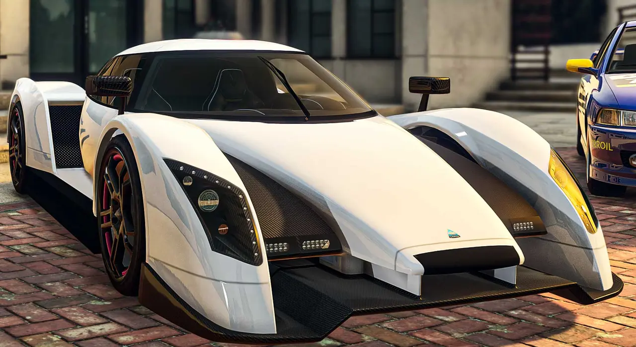 White Overflod Entity XF parked between two other cars on a brick driveway