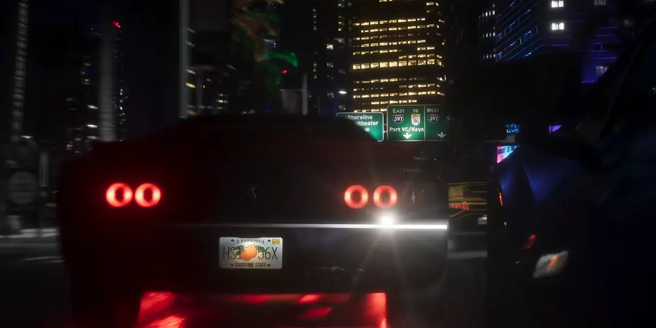 Rear view of a dark muscle car with round red tail lights on a Vice City street at night