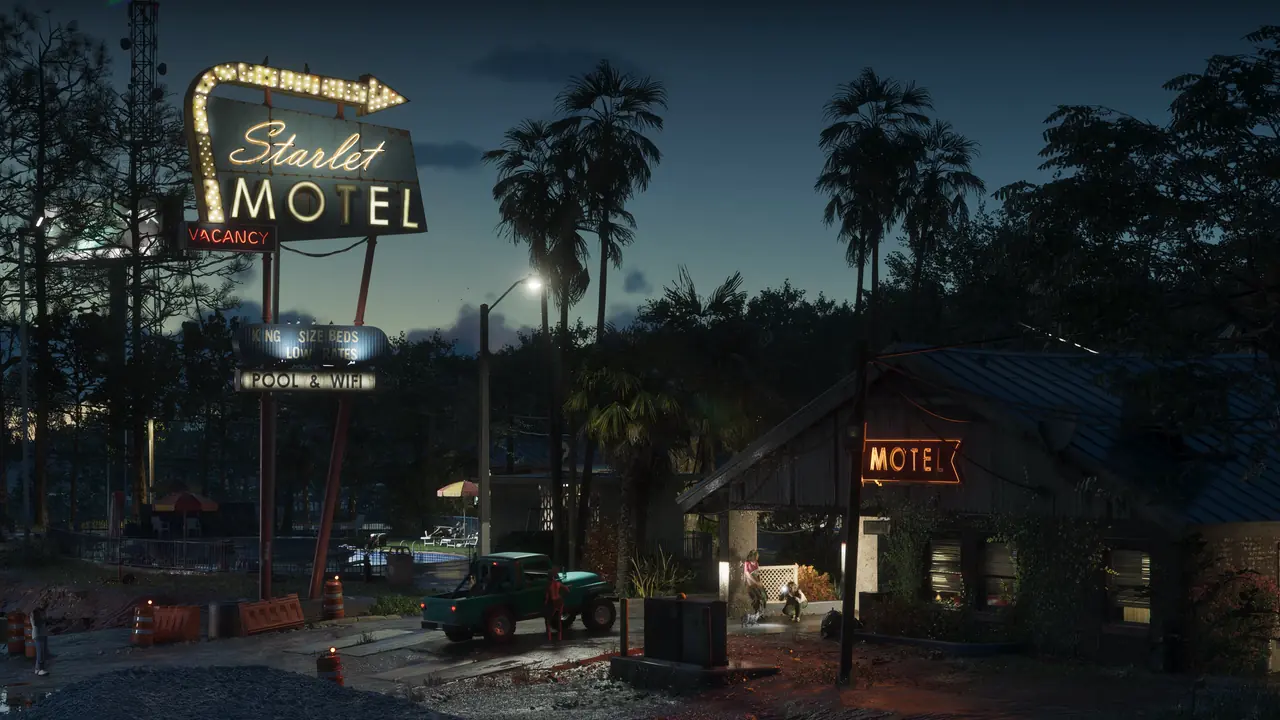 The Starlet Motel in Port Gellhorn at dusk, with an old neon motel sign and palm trees