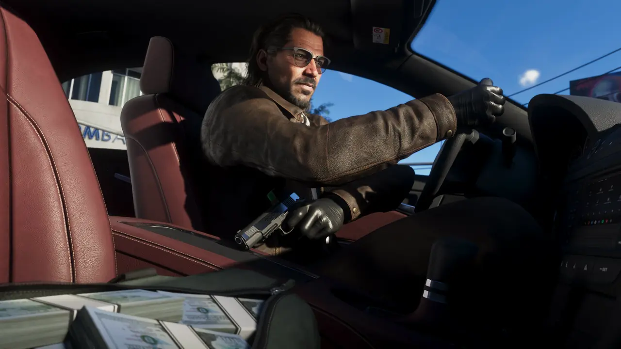 Raul Bautista in sunglasses and gloves driving a car, with a pistol and bundles of cash on the seat